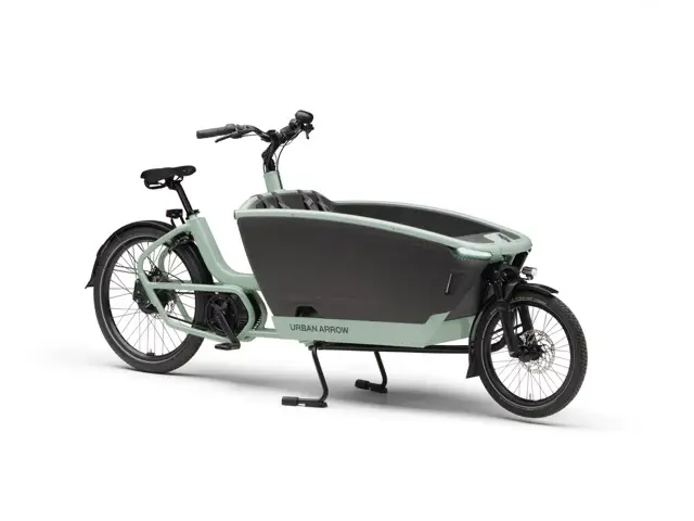 Urban Arrow Family Next electric cargo bike in green, with front box for carrying kids